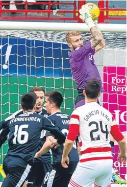  ?? Picture: SNS Group. ?? Dundee keeper Scott Bain deals with this corner against Hamilton, but the Dark Blues conceded another goal at Kilmarnock on Saturday.