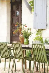  ??  ?? Exterior
Modern outdoor furnishing­s resonate with the contempora­ry details found inside. The shutters were colour-matched to early photos of the house. Hay Palissade stacking chair, Made In Design