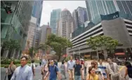  ?? SAM KANG LI / BLOOMBERG ?? Singapore’s Raffles Place — the seat of business and finance in the Lion City. Hong Kong could learn from the island state’s experience in curbing hoarding among property developers and secure the working of the free-market mechanism.