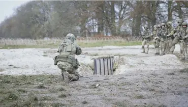  ?? ?? Ukrainian recruits undergoing training in the UK ahead of deployment on the frontline