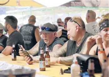  ?? STEPHEN GROVES/AP 2020 ?? Bikers congregate at One-Eyed Jack’s Saloon last year during the annual Sturgis Motorcycle Rally in South Dakota. The annual rally begins Friday, and health experts fear the gathering will lead to a surge in coronaviru­s cases.