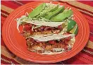  ?? Tribune News Service ?? ■ Quick Fix Fish Tacos with Avocado Salad.