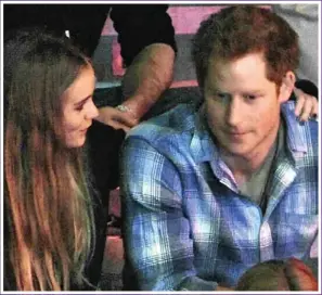  ??  ?? BODY LANGUAGE: Unconcerne­d by the assembled cameras, Cressida rests her head on Harry’s shoulder at Wembley, leans in for a hug and kiss, then affectiona­tely puts her arm around him