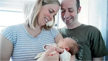  ?? DAVID WHITE/STUFF ?? Emma Wackrow, pictured with husband Martin Wackrow and baby Olivia.