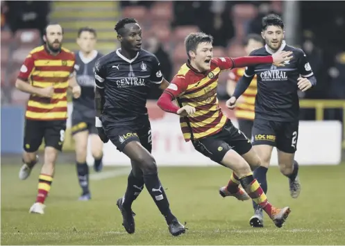  ?? PICTURE: ROB CASEY/SNS ?? 0 Falkirk’s Abdul Osman, left, moves in to press Partick Thistle’s goalscorer Blair Spittal.