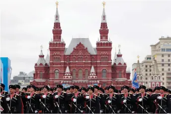  ??  ?? Cossacks march along Red Square during the Victory Day military parade in Moscow.