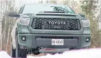  ??  ?? The front end is eye-catching, with a large grille and hood scoop. The Tundra’s interior features heated seats and a large console.