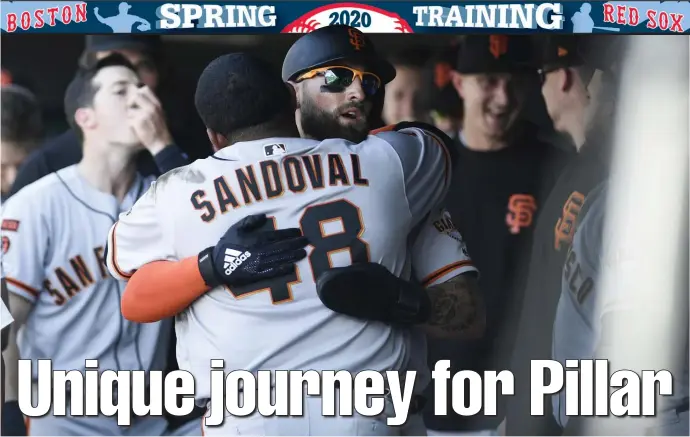  ?? AARON ONTIVEROZ / THE DENVER POST ?? PANDA HUGS: After scoring on an error, Kevin Pillar gets a hug from Pablo Sandoval in the Giants dugout.