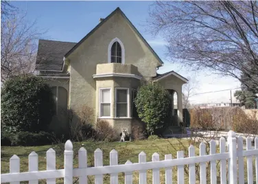  ?? Scott Sonner / Associated Press ?? The 19th century Nystrom Guest House began operating as a boarding house for divorce seekers in the 1920s. A developer hopes to move it to a new site, but some critics would like the house to stay where it is.