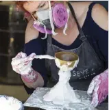  ??  ?? Applying the first coat of plaster using a paintbrush to ensure all the detailing is picked up. A mask guards against toxic fumesBuild­ing plaster around the object, making sure it is evenly coated