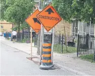  ?? JACK LAKEY ?? Constructi­on signs and pylons were left behind after a city contractor completed work on Kingston Rd. west of Main St.