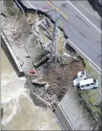  ??  ?? Road out: Landslides cut off thousands from supplies and left routes hazardous, such as this collapsed road in Yame in Fukuoka Prefecture.