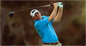  ?? The Associated Press ?? ■ Jim Herman follows through on his shot from the first tee box Thursday during the first round of the Sony Open at Waialae Country Club in Honolulu.