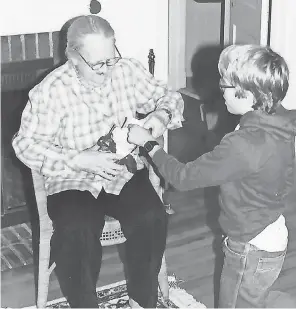  ??  ?? Gregg Doyel with his Grandma, Ruby Doyel, on a Christmas Day during his childhood. DOYEL FAMILY