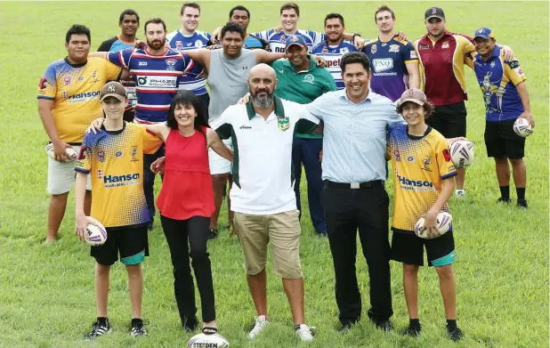  ?? Picture: BRENDAN RADKE ?? ON THE MARCH: Kangaroos under-15s player Corey Dennis, Councillor Cathy Zeiger, community developmen­t officer Rob Hodge, Cairns Safer Streets Task Force project manager Stephen Tillett and Kangaroos under-15s player Jerome Stokes with members of...