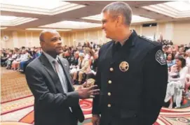  ??  ?? Denver Mayor Michael Hancock, left, talks with Denver Sheriff Patrick Firman before the Denver Sheriff ’s Academy Class graduation at the Renaissanc­e Hotel on May 13. Eighty graduates were part of the class. Andy Cross, The Denver Post