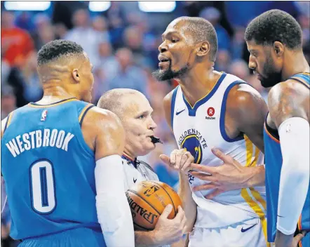  ?? [NATE BILLINGS/THE OKLAHOMAN] ?? Russell Westbrook and the Oklahoma City Thunder will not back down from the defending two-time NBA champion Golden State Warriors. In this photo, a referee and the Thunder's Paul George, right, step in between Westbrook and Warriors star Kevin Durant.