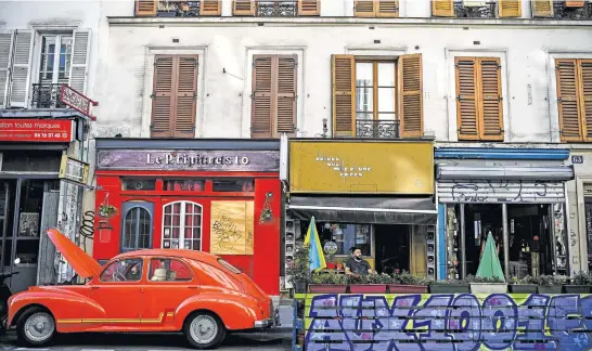  ?? Pictures: AFP ?? KEEPING HIS DISTANCE. A man sits at a cafe with an extended terrace made of wooden pallets in Paris in respect for social distancing due to the Covid -19 pandemic.