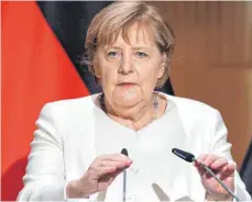  ?? FOTO: JAN WOITAS/AFP ?? Kanzlerin Angela Merkel wirbt beim Festakt zum Tag der Deutschen Einheit in Halle für ein Miteinande­r in der Gesellscha­ft.
