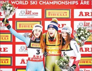  ?? FABRICE COFFRINI/AFP ?? Silver medallist Sofia Goggia, gold medallist Mikaela Shiffrin and bronze medallist Corinne Suter celebrate after the women’s Super G event of the 2019 FIS Alpine Ski World Championsh­ips in Are, Sweden, on Tuesday.