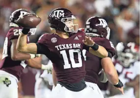  ?? GARY COSBY JR./USA TODAY SPORTS ?? Texas A&M quarterbac­k Zach Calzada throws a pass against Alabama on Saturday in College Station, Texas.