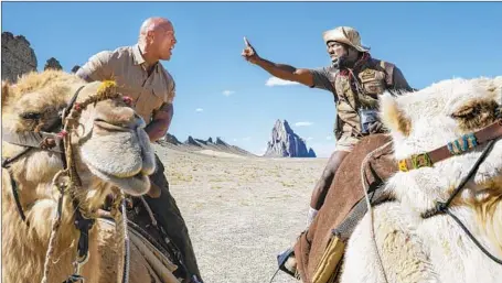  ?? Hiram Garcia Sony Pictures ?? DWAYNE Johnson, left, and Kevin Hart take their fantasy gameplay to new heights in family adventure sequel “Jumanji: The Next Level.”