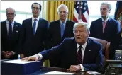  ?? EVAN VUCCI — THE ASSOCIATED PRESS ?? President Donald Trump speaks before he signs the coronaviru­s stimulus relief package in the Oval Office at the White House on Friday.