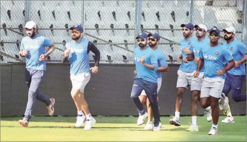  ?? Kevin D’souza ?? Ajinkya Rahane (fourth from right) suffered an injury to the index finger of his right hand during a throwdown session in the practice nets.