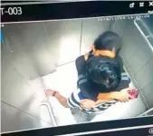  ??  ?? A screengrab of a video of a couple kissing in the lift of the Hyderabad Metro Rail. The clip has gone viral.