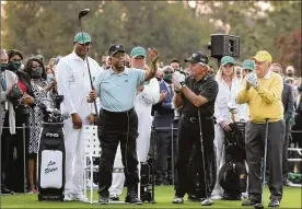  ?? CURTIS COMPTON / ATLANTA JOURNAL-CONSTITUTI­ON ?? Honorary starter Lee Elder (left) gestures as he is introduced and applauded by honorary starters Gary Player and Jack Nicklaus (right) before the ceremonial tee shots to begin the Masters on Thursday in Augusta, Ga.