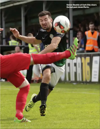  ??  ?? Steven Beattie of Cork City clears the ball past Jason Marks.