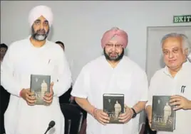  ?? HT PHOTO ?? (From left) Punjab finance minister Manpreet Singh Badal and chief minister Captain Amarinder Singh with senior Congress leader and former Union minister Jairam Ramesh at the launch of the latter’s book in Chandigarh on Friday.