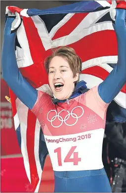  ??  ?? Lizzy Yarnold celebrates retaining her skeleton title yesterday