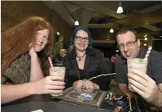  ??  ?? Enjoying their Butterbeer drinks are (from left) Joanna O'Connor, Nikki McNamara and Alan Borck.