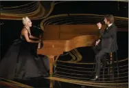  ?? CHRIS PIZZELLO ?? FILE - This Feb. 24, 2019 file photo shows Lady Gaga, left, and Bradley Cooper performing “Shallow” from “A Star is Born” at the Oscars in Los Angeles.