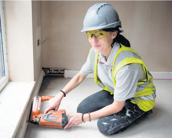  ??  ?? > Prince’s Trust ambassador Alleisha Carey on the Anwyl constructi­on site at Maes Helyg on Deeside