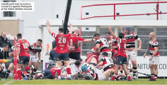  ??  ?? Llanelli push over to score a crucial try against Pontypool at the Talbot Athletic Ground.