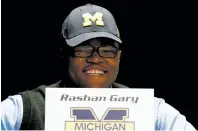  ?? JULIO CORTEZ/ASSOCIATED PRESS FILE PHOTO ?? High school defensive tackle Rashan Gary smiles during his announceme­nt to play at Michigan in 2016 in Paramus, N.J. Traditiona­lly in February, the NCAA authorized a 72-hour early signing window from Dec. 20-22 for the Class of 2018.