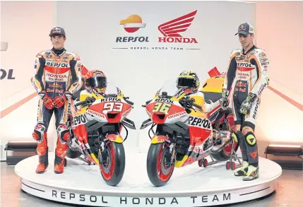  ?? AFP ?? Honda riders Marc Marquez, left, and Joan Mir pose with their RC213V bikes ahead of the season opener in Portugal.