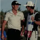  ?? FERNANDO LLANO/AP ?? Viktor Hovland celebrates with his caddie after winning the Hero World Challenge.