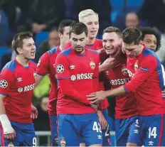  ?? AP ?? Moscow forward Fedor Chalov (centre) celebrates with his teammates after scoring the opening goal against Real Madrid.