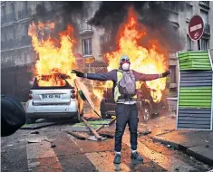  ??  ?? Clockwise from top: Burnt-out cars on Kleber Avenue in Paris; cars in flames on Foch Avenue; Emmanuel Macron, Christophe Castaner, interior minister, and Michel Delpuech, Paris police prefect, visit firefighte­rs and the police