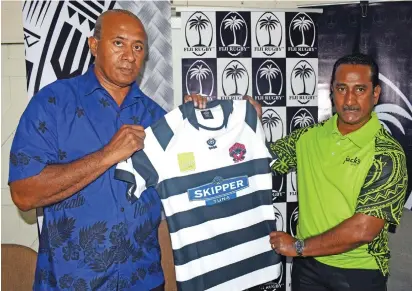  ?? Photo: Vilimoni Vaganalau. ?? Jack’s of Fiji business developmen­t manager Madan Krishna (right) hands over the Skipper 10’s jersey to Rewa Rugby president Ro Filipe Tuisawau at the Fiji Rugby Union office on January 12, 2018 .
