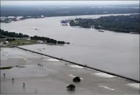  ?? GERALD HERBERT — THE ASSOCIATED PRESS FILE ?? One continuing concern is the massive volume of water that for months has been pushing against levees protecting a city that’s mostly below sea level.