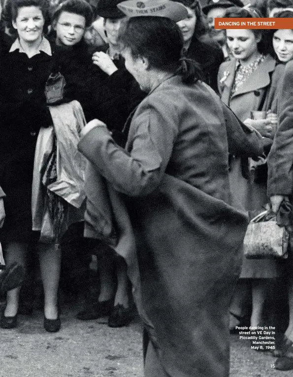  ??  ?? People dancing in the street on VE Day in Piccadilly Gardens, Manchester. May 8, 1945