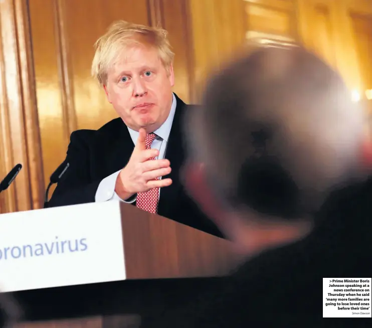  ?? Simon Dawson ?? > Prime Minister Boris Johnson speaking at a news conference on Thursday when he said ‘many more families are going to lose loved ones before their time’