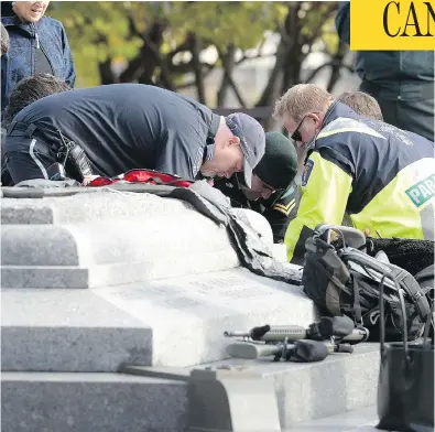  ?? ADRIAN WYLD / THE CANADIAN PRESS ?? Bystanders were among those who tried to resuscitat­e Cpl. Nathan Cirillo at the National War Memorial in 2014.