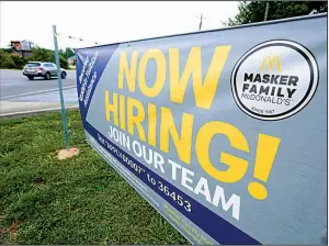  ?? AP ?? A sign advertises job openings in June at a McDonald’s restaurant in Moss Point, Miss. U.S. hiring accelerate­d in July for a second month, payroll processor ADP reported Wednesday.