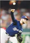  ??  ?? Milwaukee Brewers starting pitcher Jordan Lyles throws during the third inning of the team’s baseball game against the Washington Nationals
on Aug 17 in Washington. (AP)