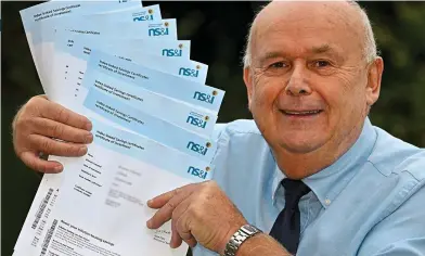  ?? ?? Happy investor: Peter Coppenhall, with his NS&I savings certificat­es
